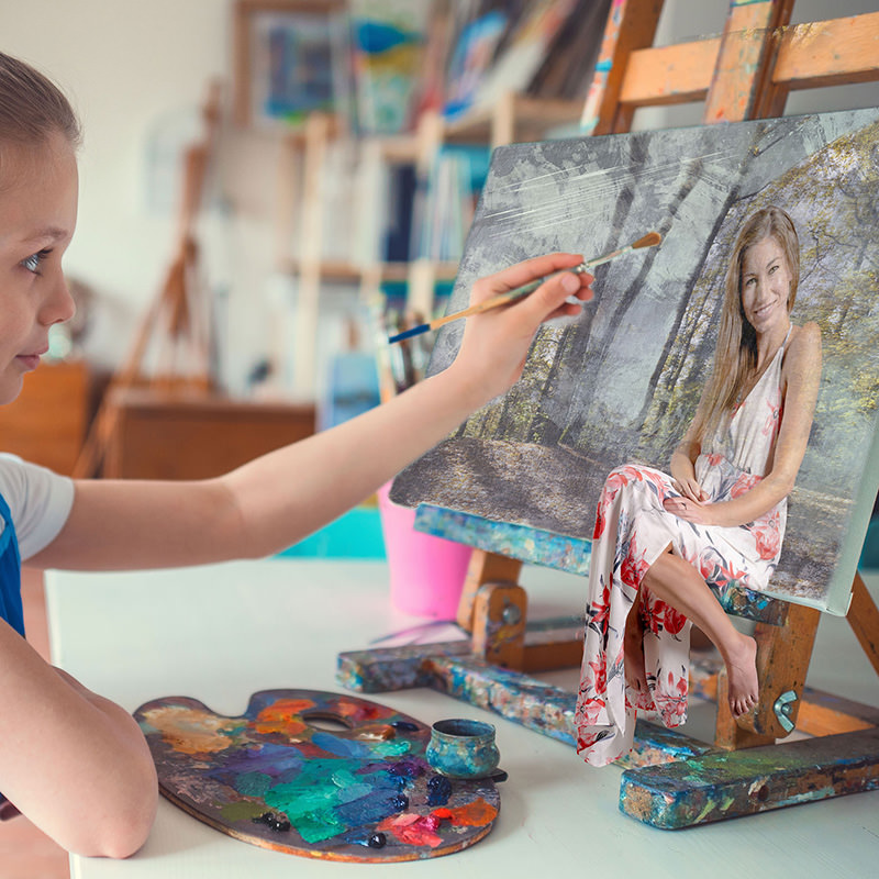 Young girl holding a paintbrush near a canvas on an easel, where a realistic image of a woman in a floral dress sitting in a forest is painted, blending painting and reality imagination.