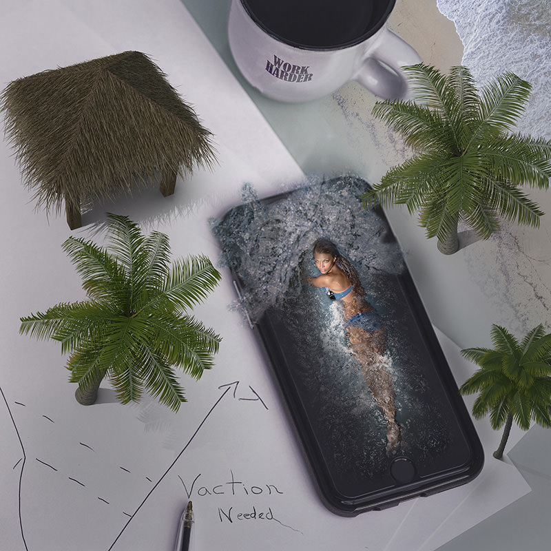 A woman in a blue bikini appears to swim inside a smartphone screen surrounded by palm trees, a thatched hut, a pen, and a paper note that says 'Vacation Needed,' with a coffee mug that says 'Work Harder' in the background.